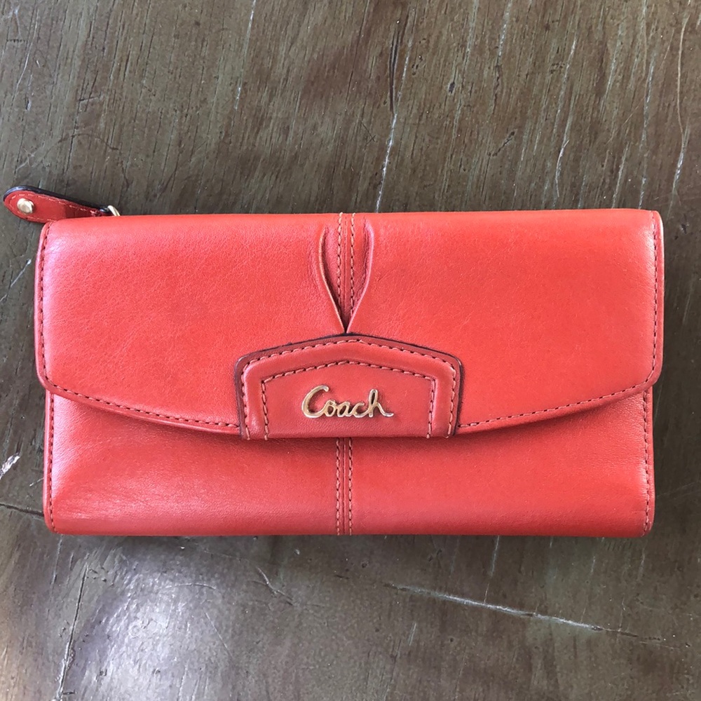 Orange Coach tri-fold wallet